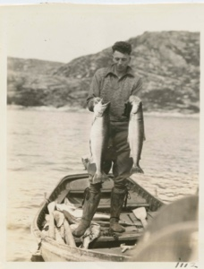 Image: Salmon and trout held up by Oakley
